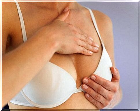 Woman showing early symptoms of breast cancer