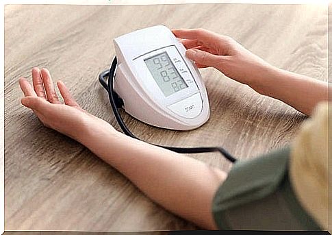 A person who measures their blood pressure