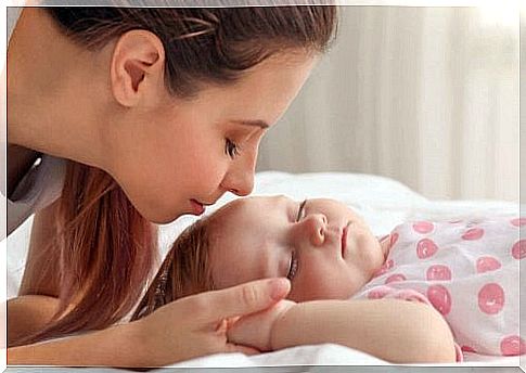 Mother applying a plagiocephaly treatment to her baby