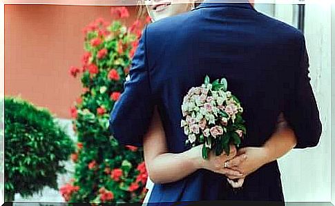 Bride and groom embracing at the wedding